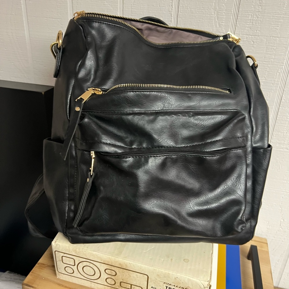 Leather backpack purse with boho chic strap.